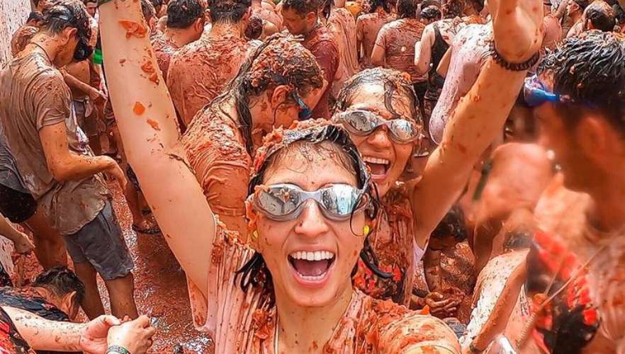 PEOPLE CELEBRATING LA TOMATINA IN SPAIN