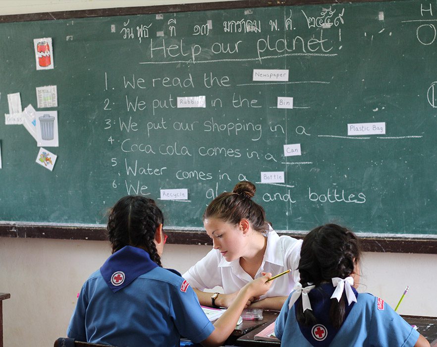 TEFL teacher with 2 students in classroom